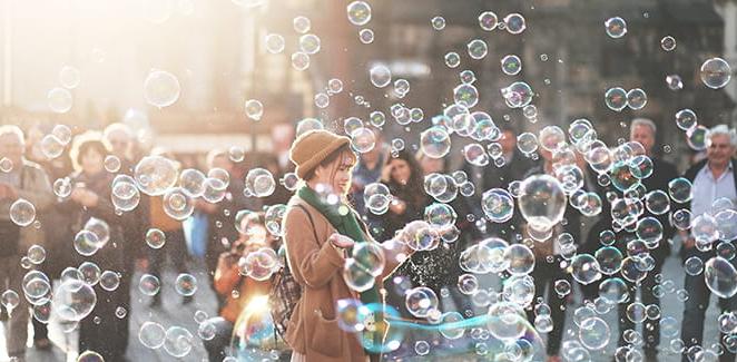 Woman blowing bubbles